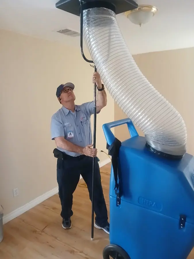 Furnace Tune-Up technician using HEPA equipment in Downers Grove